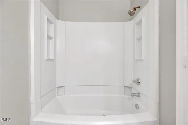 a close up of a bathtub curtain