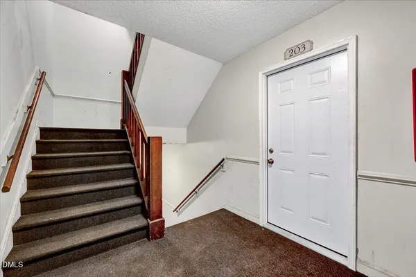 a view of entryway with stairs