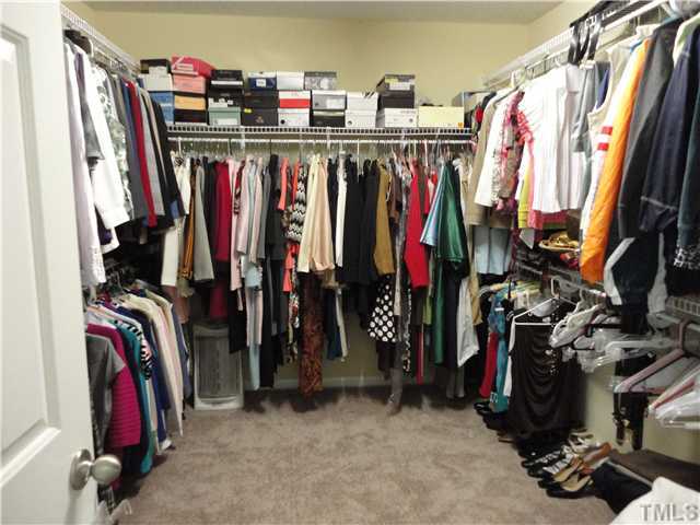 5955 Ricker Road Raleigh, NC 27610 - Photo 16 of 20 a view of walk in closet with clothes