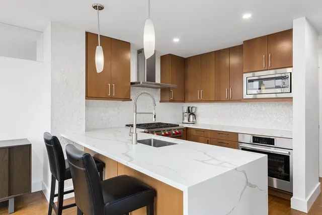 a bathroom with a toilet sink and shower