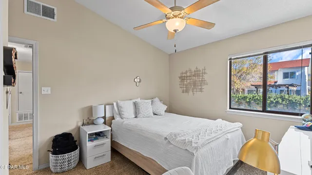 an aerial view of multiple houses with a city