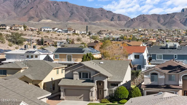 a view of multiple houses with a street