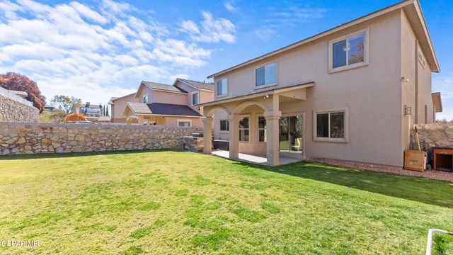 a front view of a house with a garden and porch