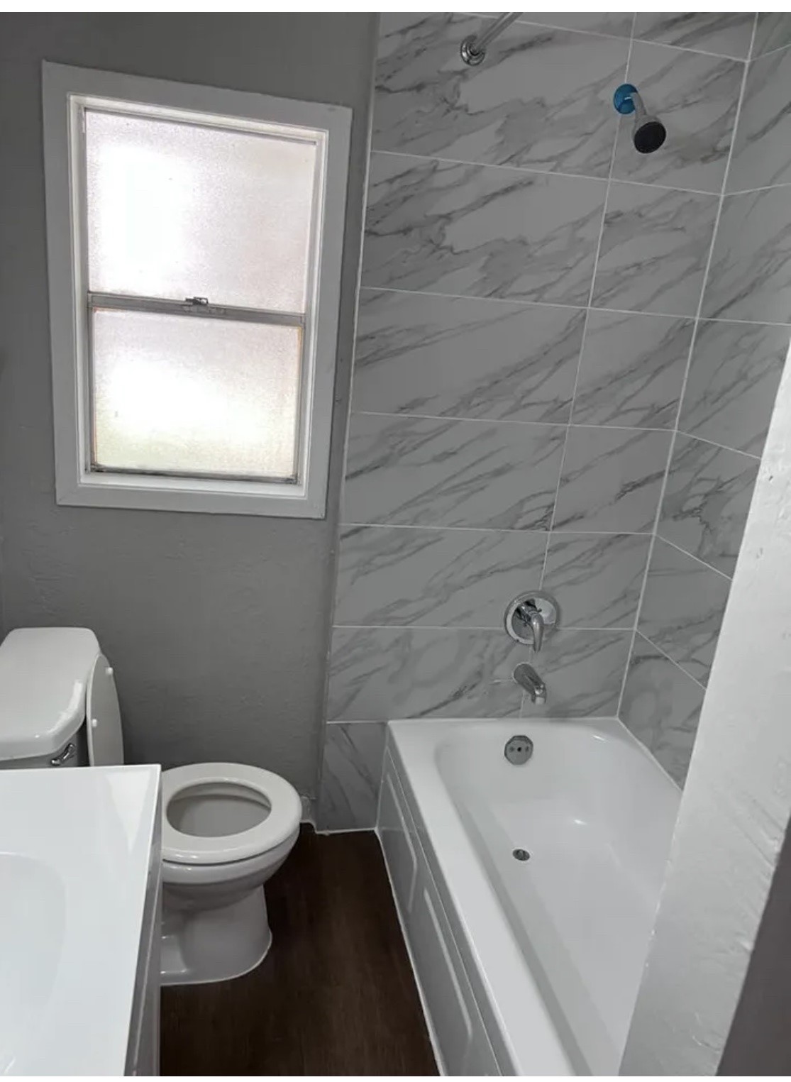 1014 East 23rd Street, Unit 3 Bryan, TX 77803 - Photo 6 of 8 a bathroom with a toilet and a sink