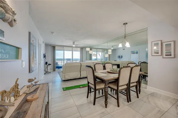 a dining room with furniture and window