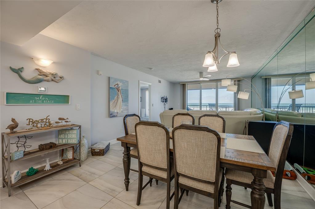 4575 South Atlantic Avenue, Unit 6304 Ponce Inlet, FL 32127 - Photo 13 of 37 a dining room with furniture and window