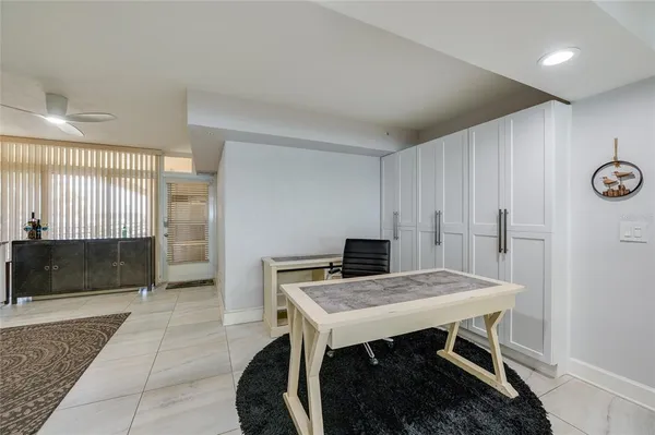 a view of a kitchen with a table and chairs