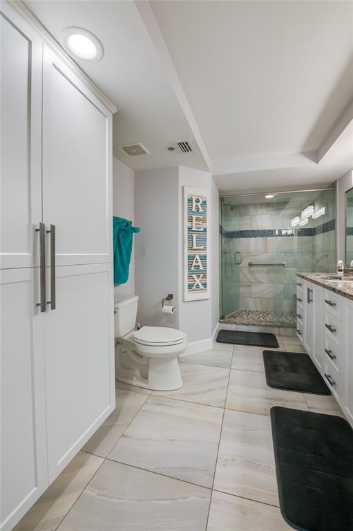4575 South Atlantic Avenue, Unit 6304 Ponce Inlet, FL 32127 - Photo 22 of 37 a bathroom with a sink a toilet and shower