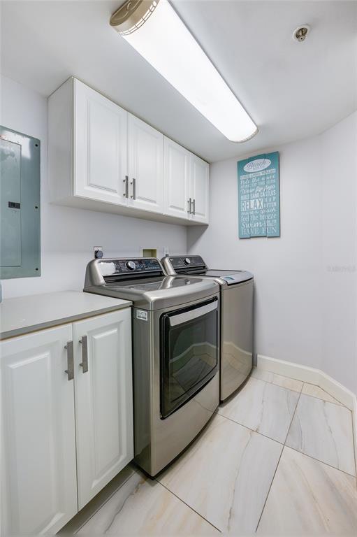 4575 South Atlantic Avenue, Unit 6304 Ponce Inlet, FL 32127 - Photo 30 of 37 a kitchen with granite countertop white cabinets and stainless steel appliances