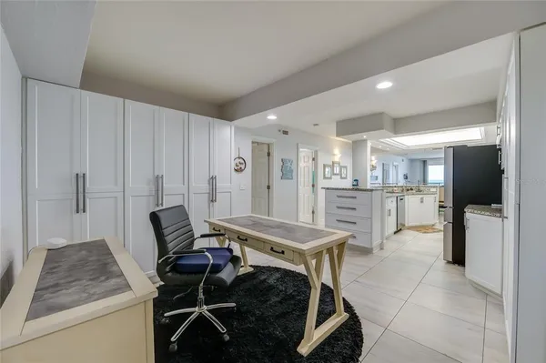 a living room with furniture a dining table and chairs