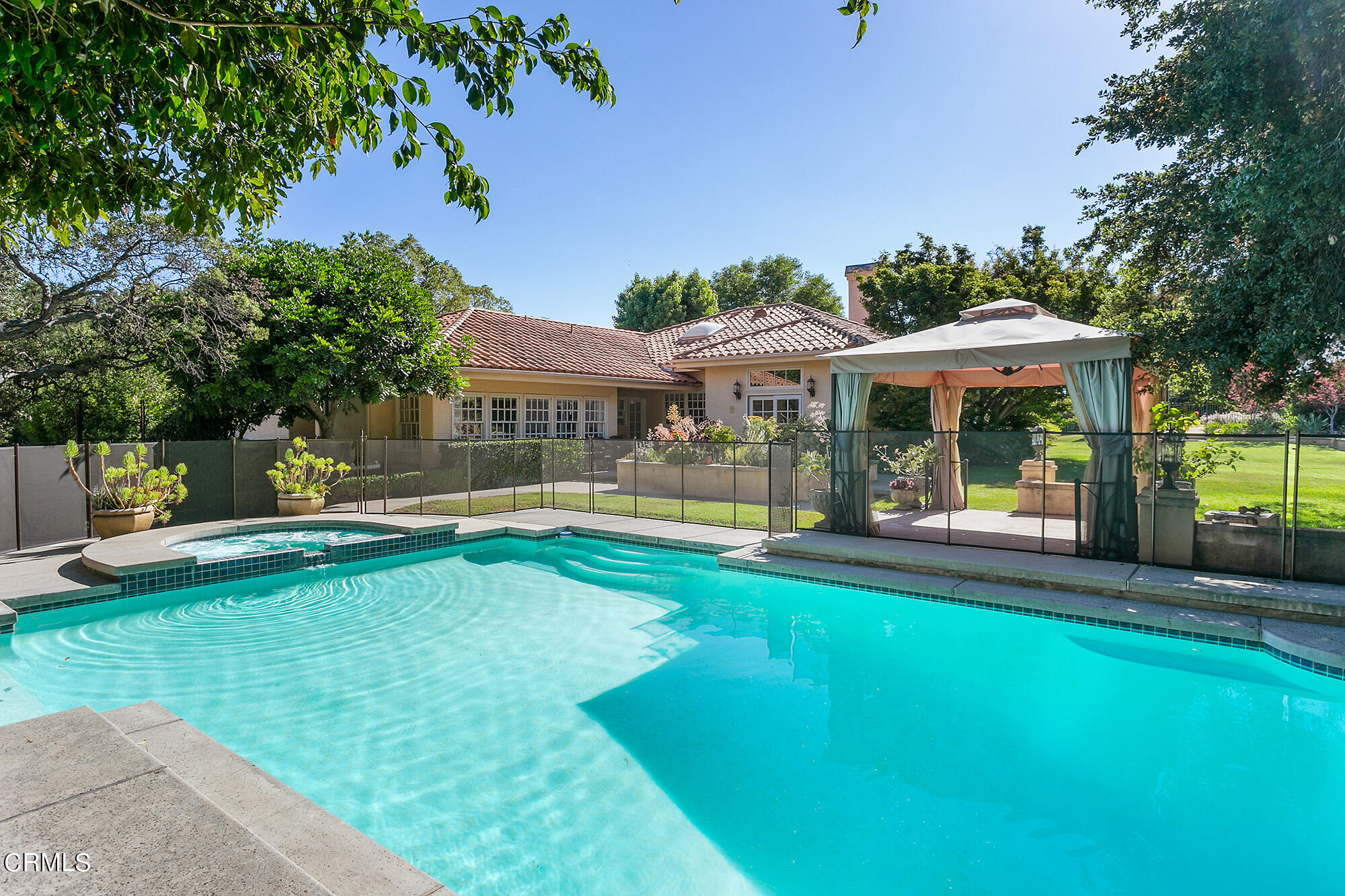 673 Deodar Lane Bradbury, CA 91008 - Photo 14 of 25 a view of a swimming pool with lawn chairs and a big yard