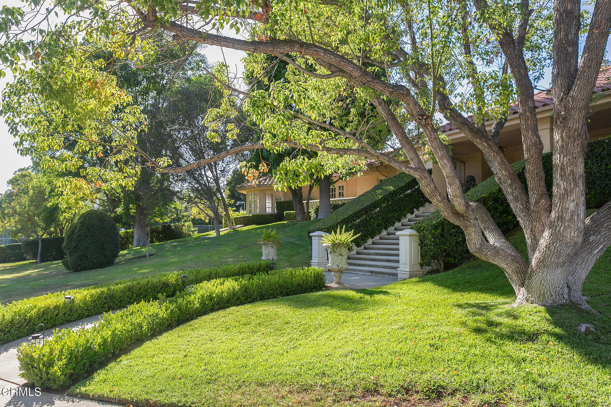 673 Deodar Lane Bradbury, CA 91008 - Photo 6 of 25 a front view of a house with a yard
