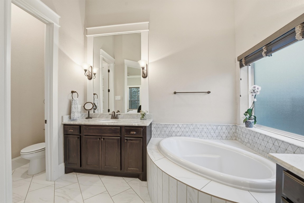 2172 Rope Maker Road Conroe, TX 77384 - Photo 21 of 50 Spacious Primary Bathroom with Separate Toilet Room, Double Vanity/sink areas, tub, and Glass Shower! All before you get to the spacious walk-in closet!