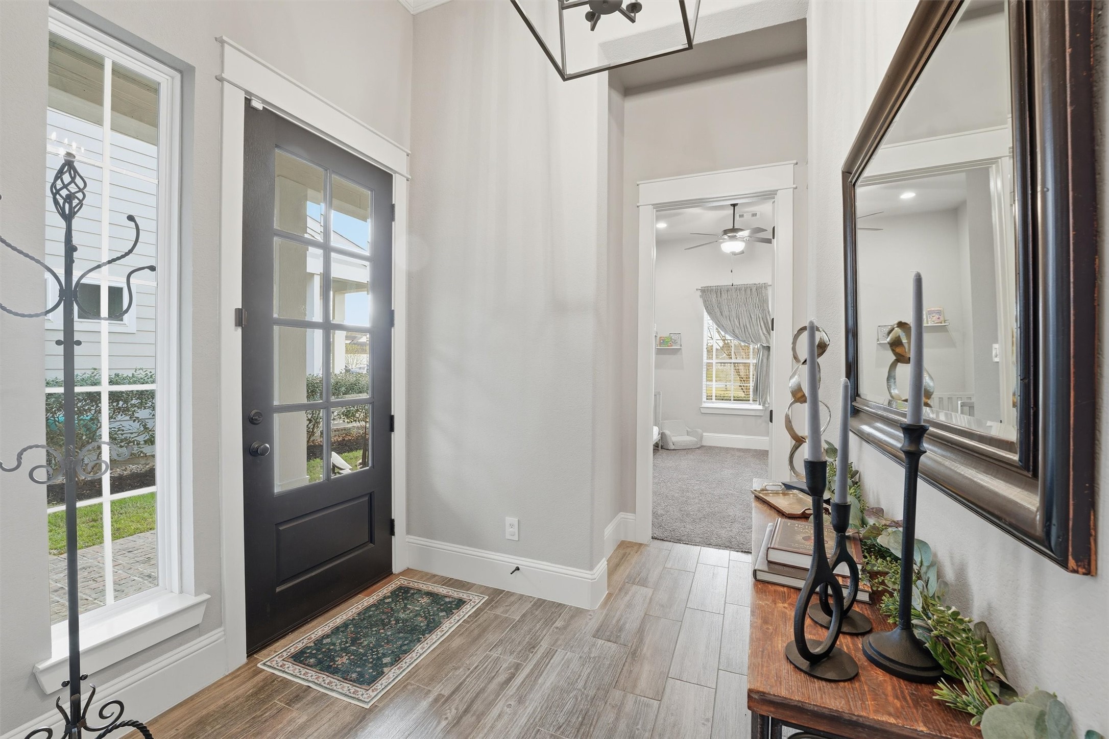 2172 Rope Maker Road Conroe, TX 77384 - Photo 50 of 50 a view of a hallway with wooden floor and windows