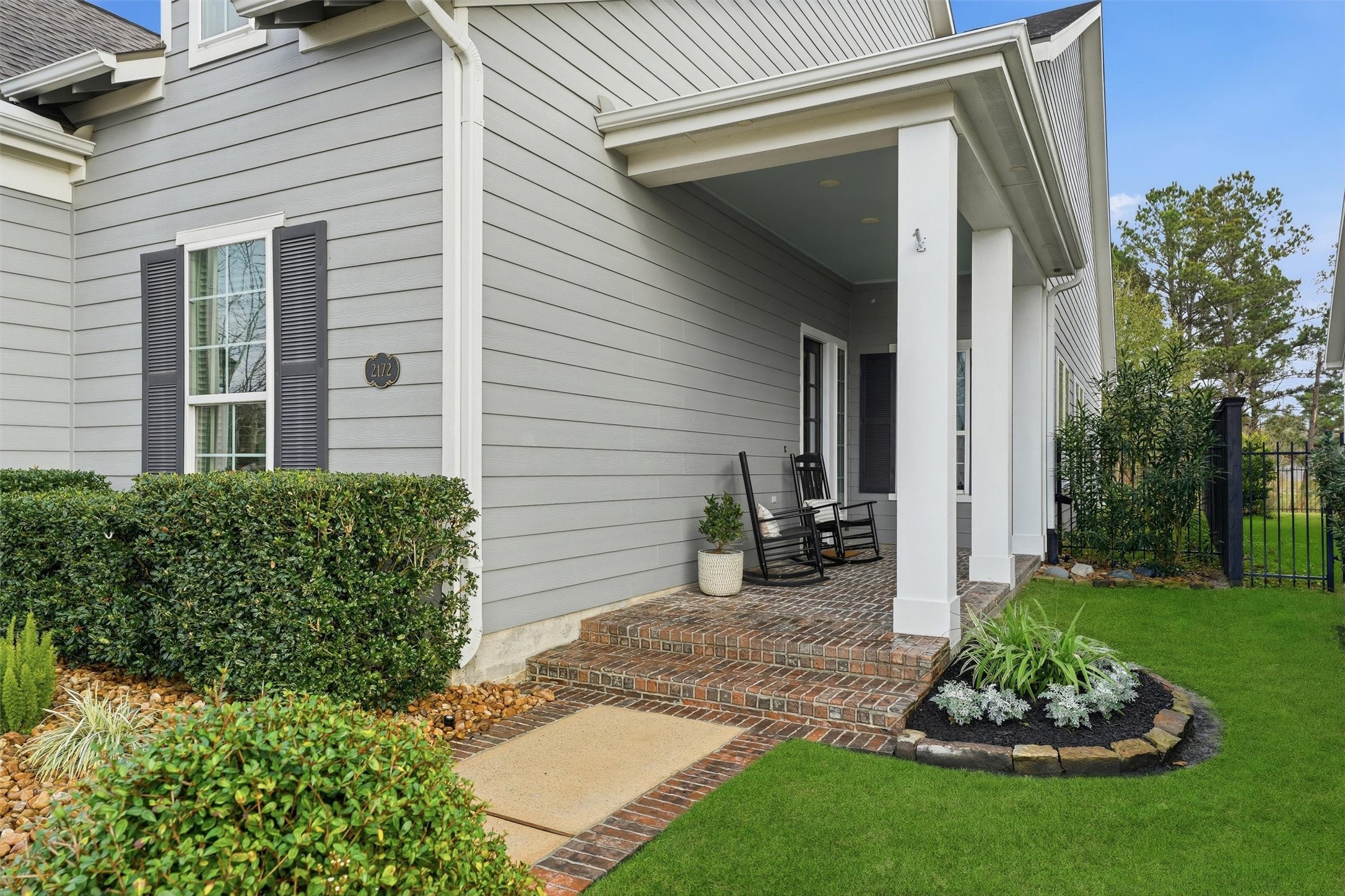2172 Rope Maker Road Conroe, TX 77384 - Photo 3 of 50 a front view of a house with a garden