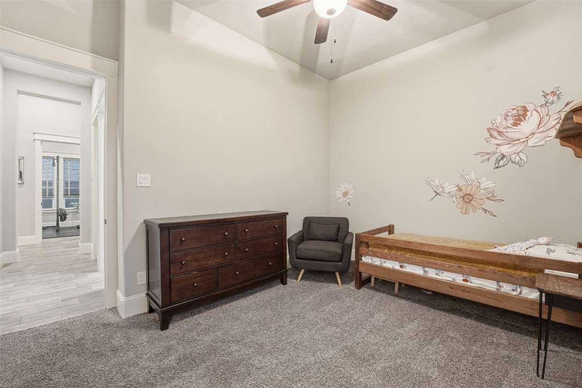 2172 Rope Maker Road Conroe, TX 77384 - Photo 30 of 50 Spacious secondary bedroom with high ceiling and ceiling fan. Privately located for quiet time!