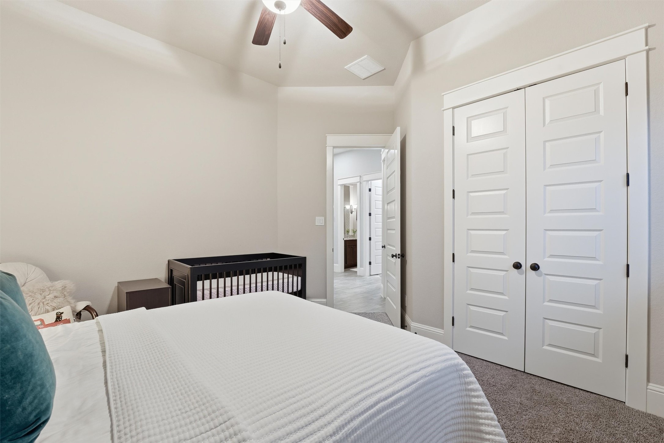 2172 Rope Maker Road Conroe, TX 77384 - Photo 32 of 50 a bedroom with a bed and a cabinet