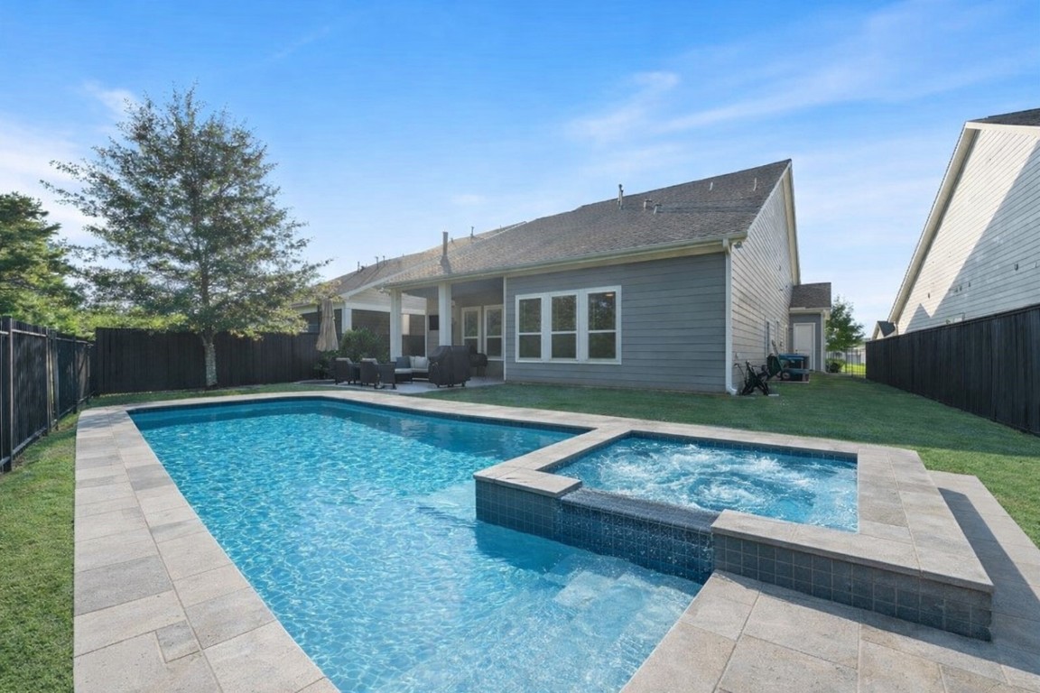 2172 Rope Maker Road Conroe, TX 77384 - Photo 38 of 50 Great backyard with well-maintained lawn, a patio area for outdoor seating, and fully fenced with nature reserve that creates privacy. Perfect for your family to enjoy and entertain. (Pool rendering)