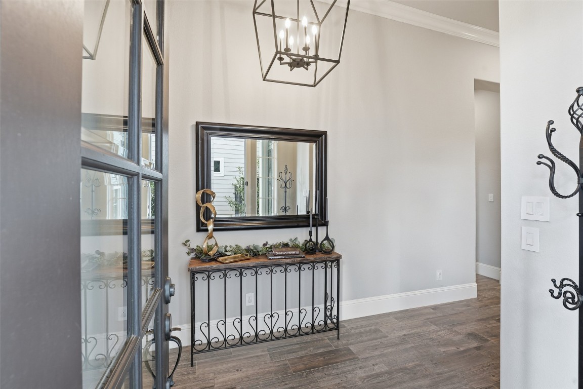 2172 Rope Maker Road Conroe, TX 77384 - Photo 6 of 50 This entryway features a modern design with room for a large mirror and decorative console table or whatever you would like to welcome your family and friends. The neutral colors and elegant lighting fixture create a welcoming atmosphere, complemented by stylish flooring.