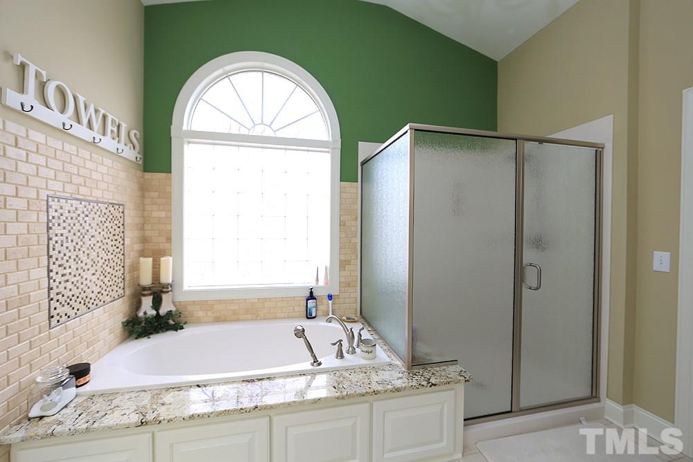521 Competition Road Raleigh, NC 27603 - Photo 12 of 25 WOW! New marble soaking tub, granite, exquisite tile work. New shower surround.