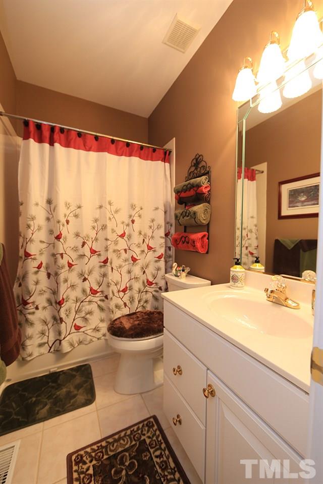 521 Competition Road Raleigh, NC 27603 - Photo 14 of 25 This full bath is located in hall next to second bedroom on main level.