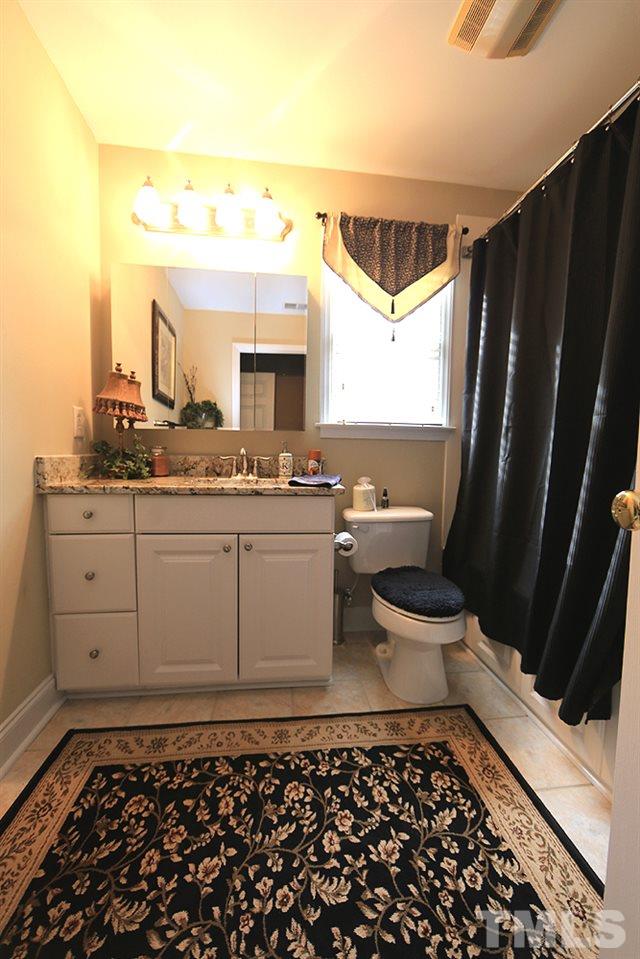 521 Competition Road Raleigh, NC 27603 - Photo 16 of 25 Beautiful large bathroom with new granite vanity top. Large soaking tub/Shower combination.