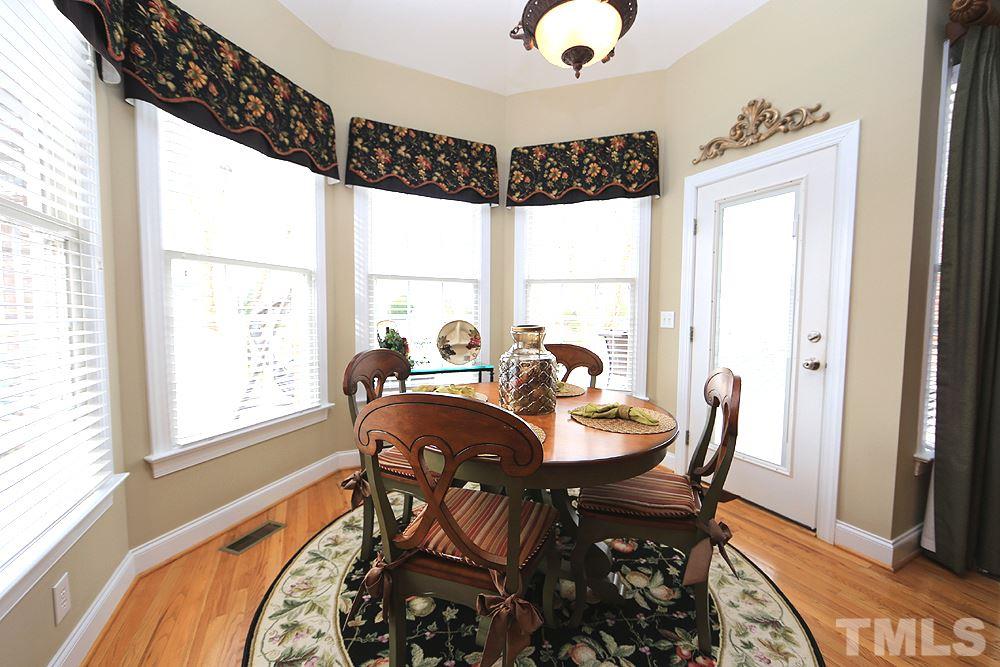 521 Competition Road Raleigh, NC 27603 - Photo 3 of 25 Beautiful breakfast area to have that morning cup of coffee before heading out to play a round of golf. Within short walking distance to grab a golf cart and play a round. Clubhouse just steps away.