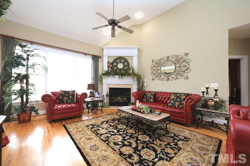 521 Competition Road Raleigh, NC 27603 - Photo 6 of 25 Another view of family room with large fireplace with gas logs.