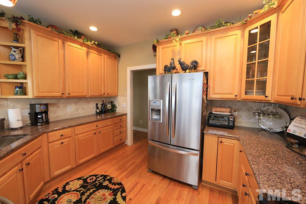 521 Competition Road Raleigh, NC 27603 - Photo 8 of 25 Beautiful kitchen with hardwood floors, Maytag SS appliances. Top notch.