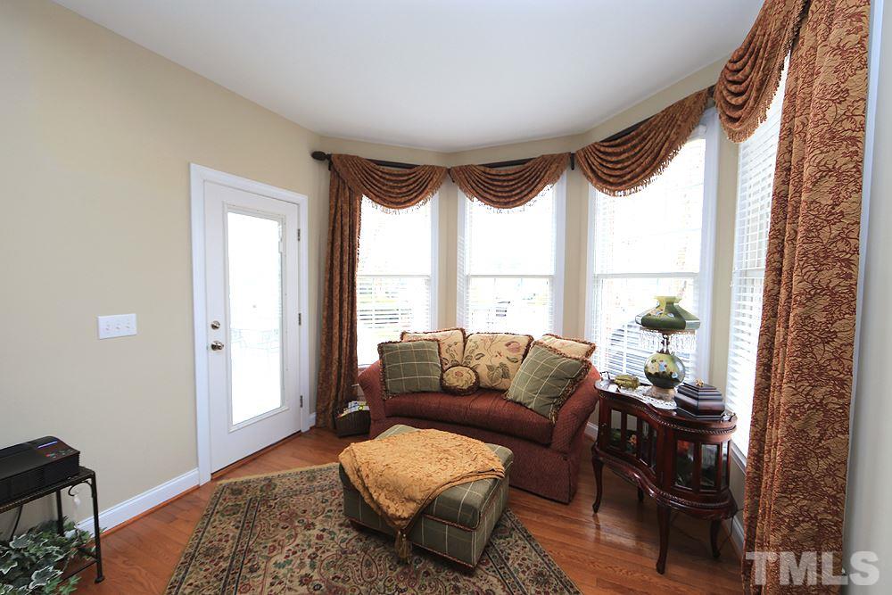 521 Competition Road Raleigh, NC 27603 - Photo 10 of 25 Master Bedroom has a sitting area big enough for a sofa and area for reading and relaxing. The door leads to the massive deck. Welcome and RELAX!