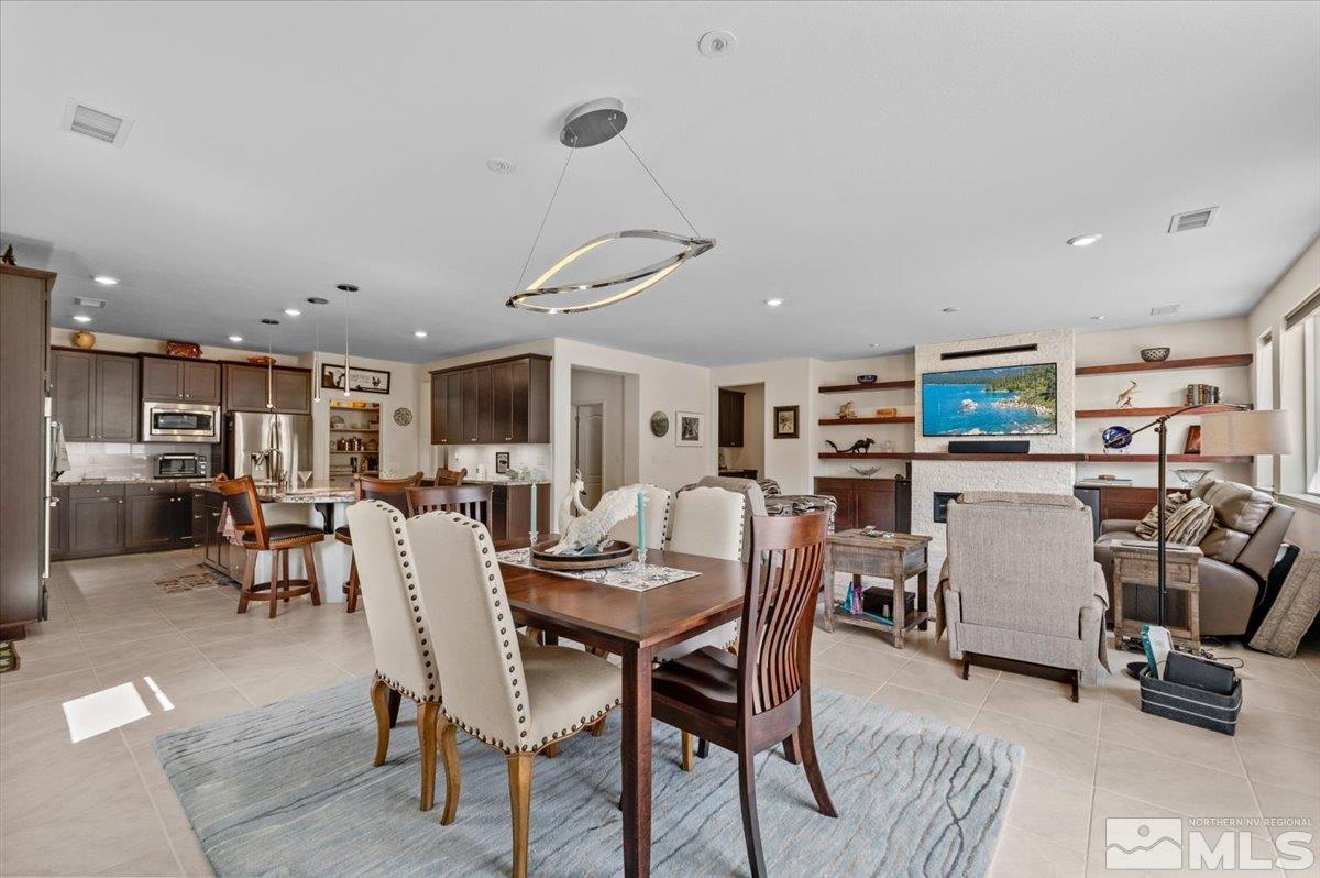 240 Noble Metal Court Reno, NV 89521 - Photo 11 of 40 a view of a dining room with furniture and a livingroom