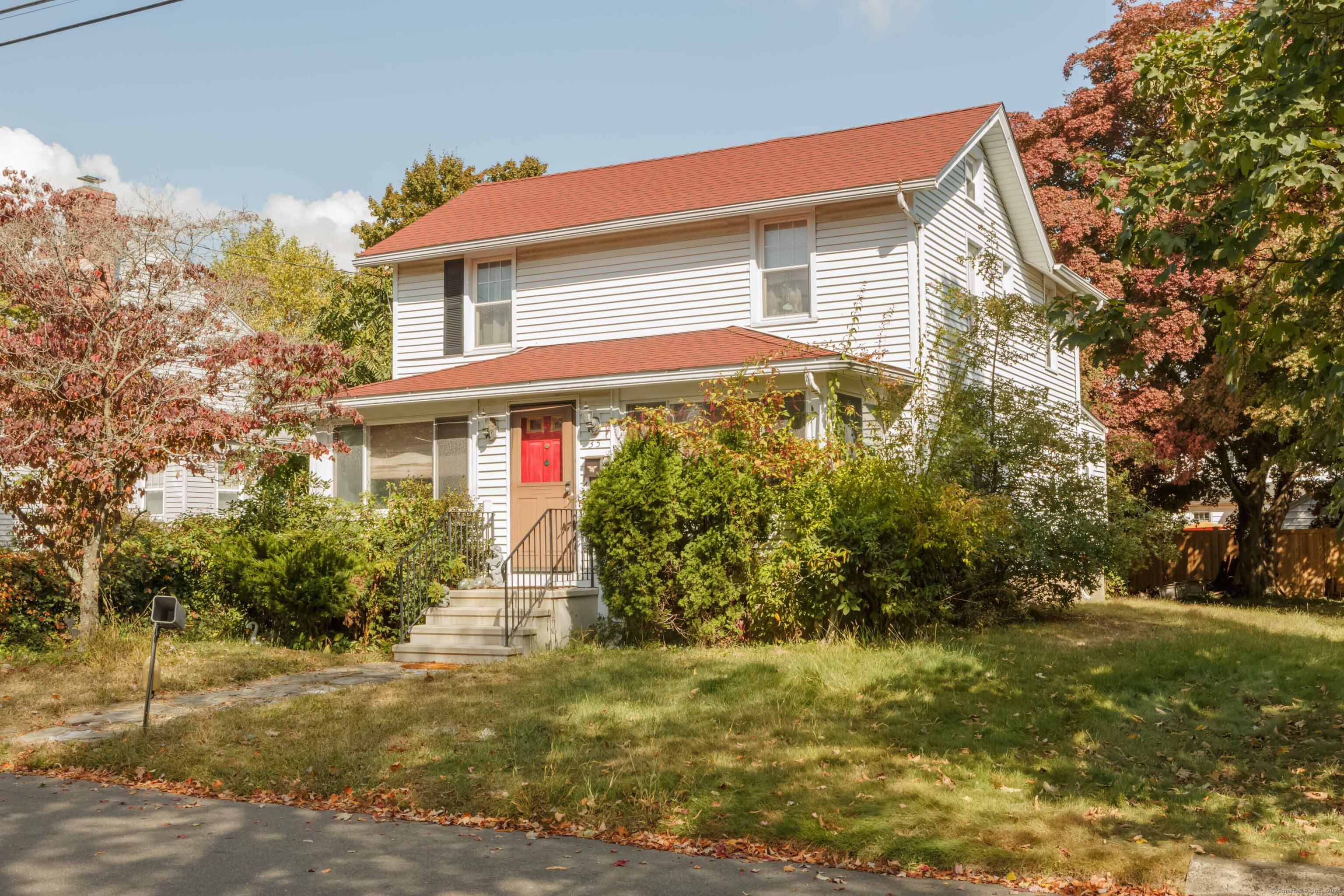Restricted Address Fairfield, CT 06824 - Photo 1 of 1 a front view of house with yard