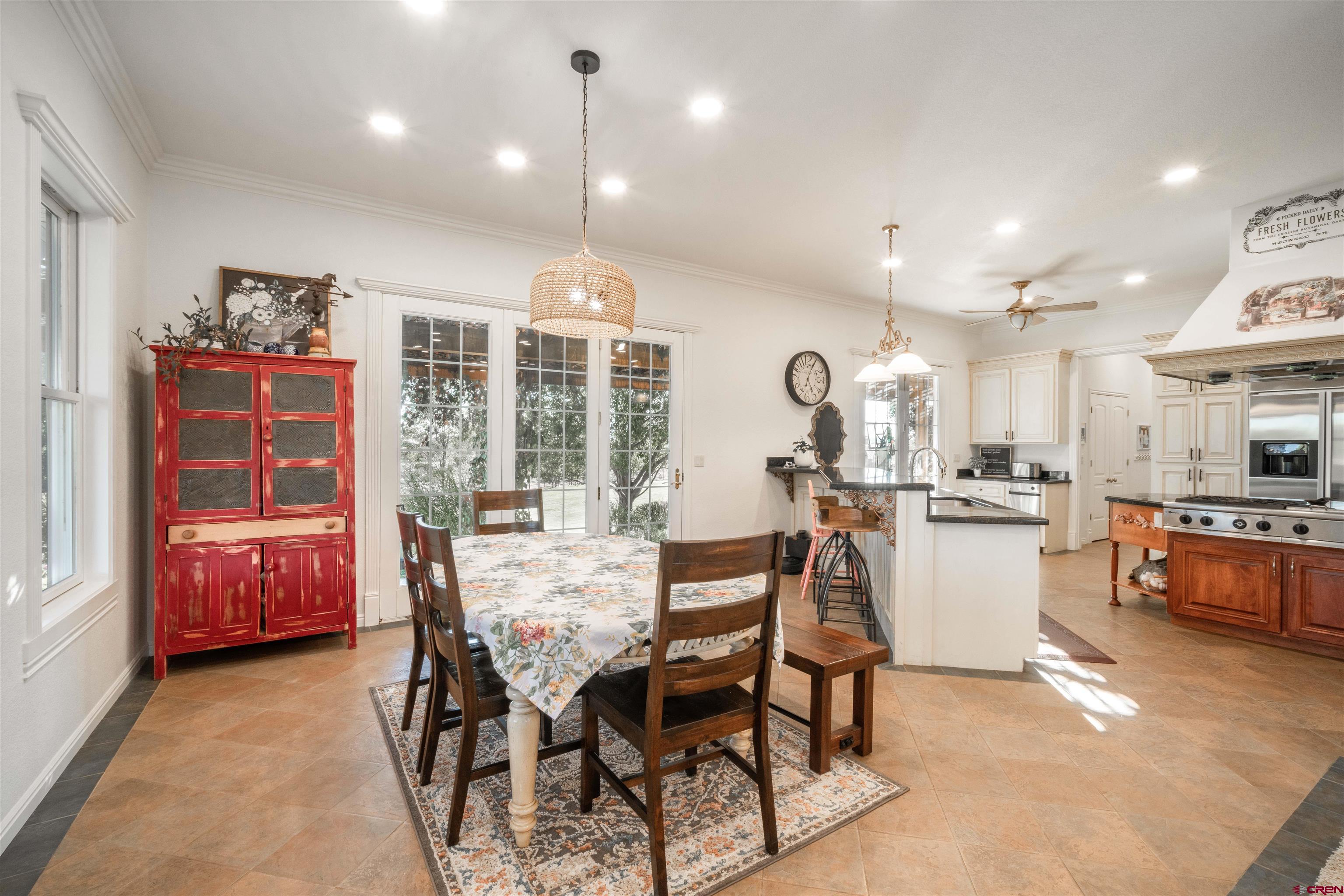 25266 Rd P Cortez, CO 81321 - Photo 11 of 41 a view of a dining room with furniture and chandelier