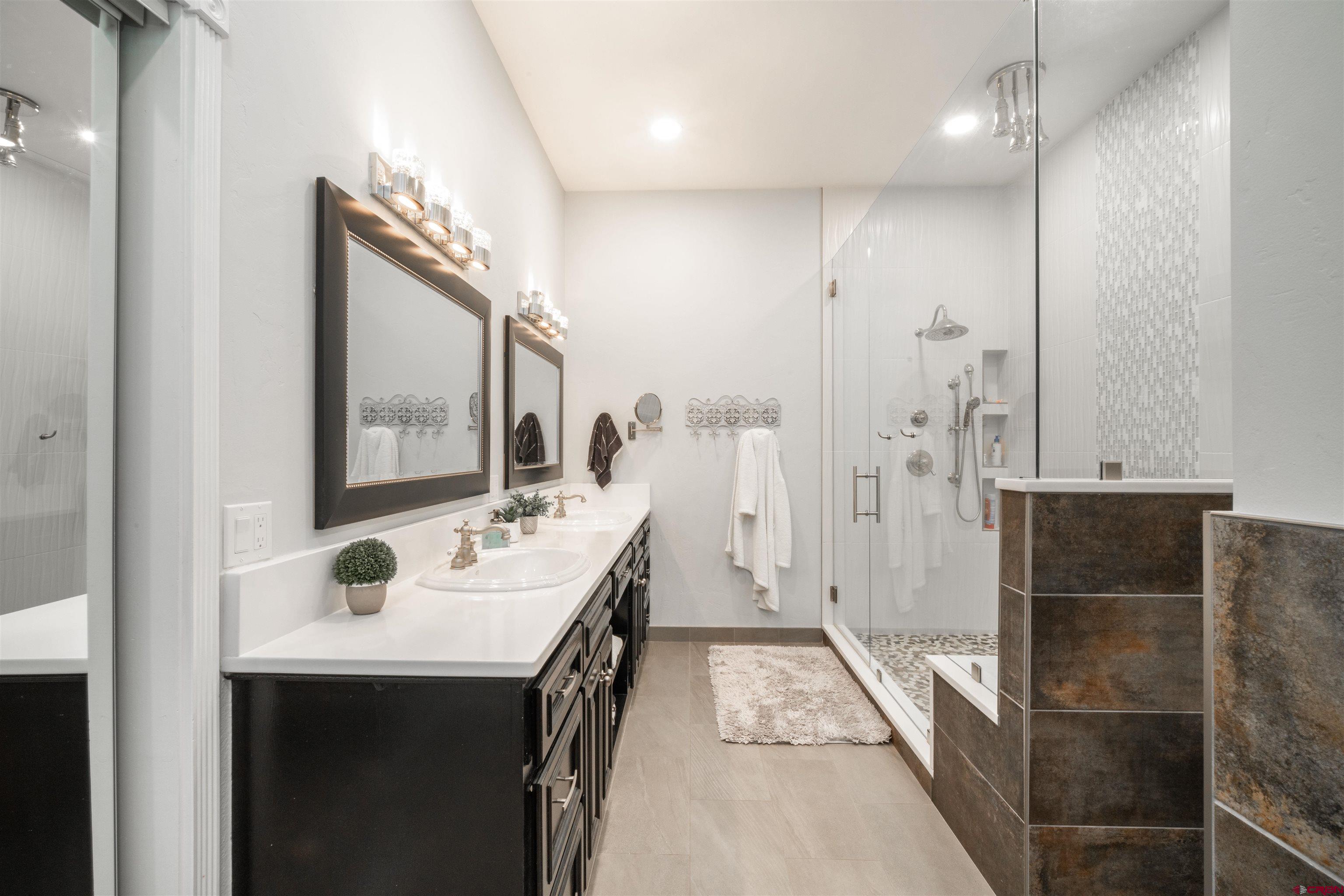25266 Rd P Cortez, CO 81321 - Photo 17 of 41 a bathroom with a sink a toilet and shower
