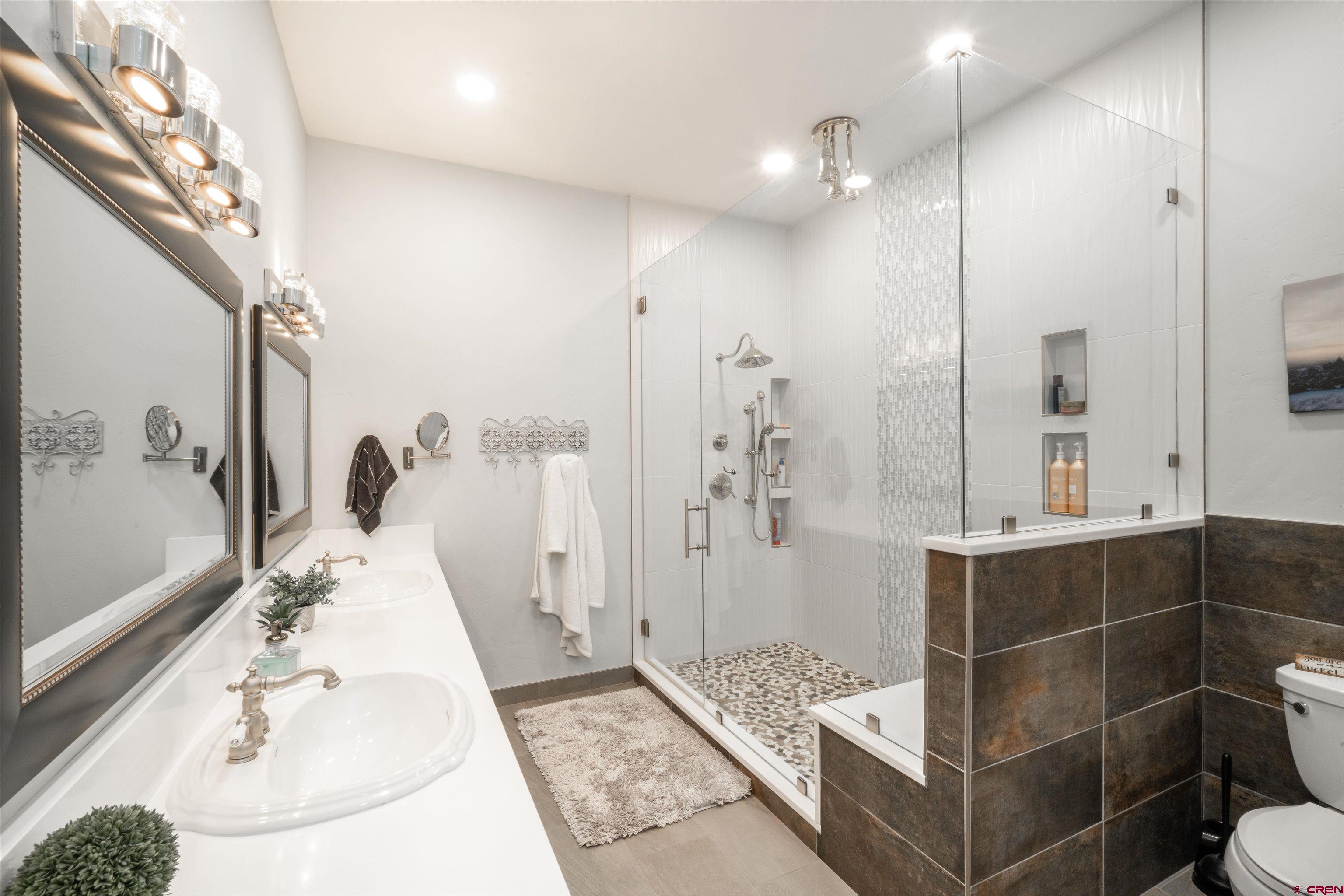 25266 Rd P Cortez, CO 81321 - Photo 18 of 41 a bathroom with a sink a toilet and shower