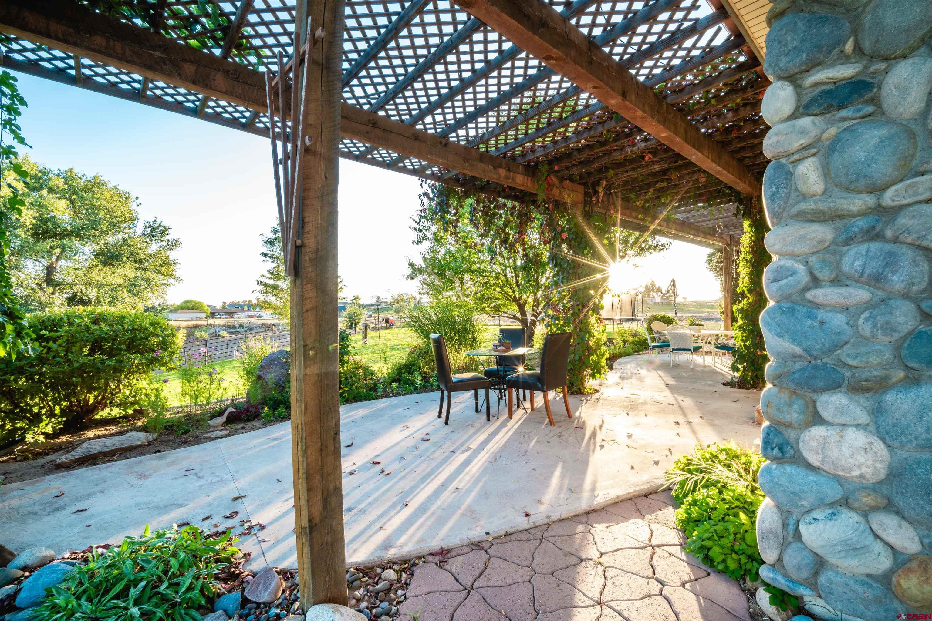 25266 Rd P Cortez, CO 81321 - Photo 26 of 41 a view of a patio with table and chairs and potted plants