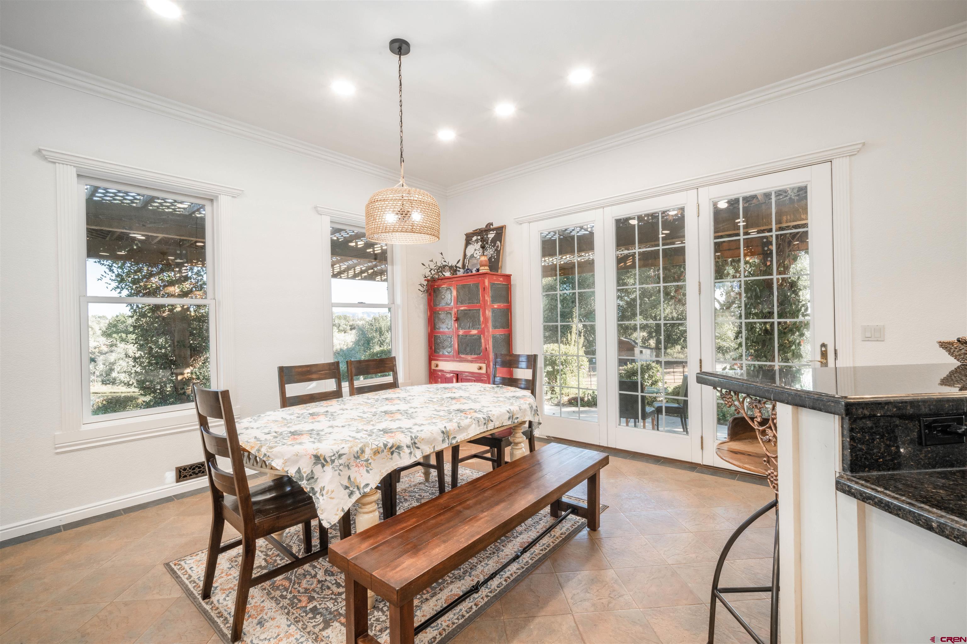 25266 Rd P Cortez, CO 81321 - Photo 10 of 41 a room with a bed a table and chairs