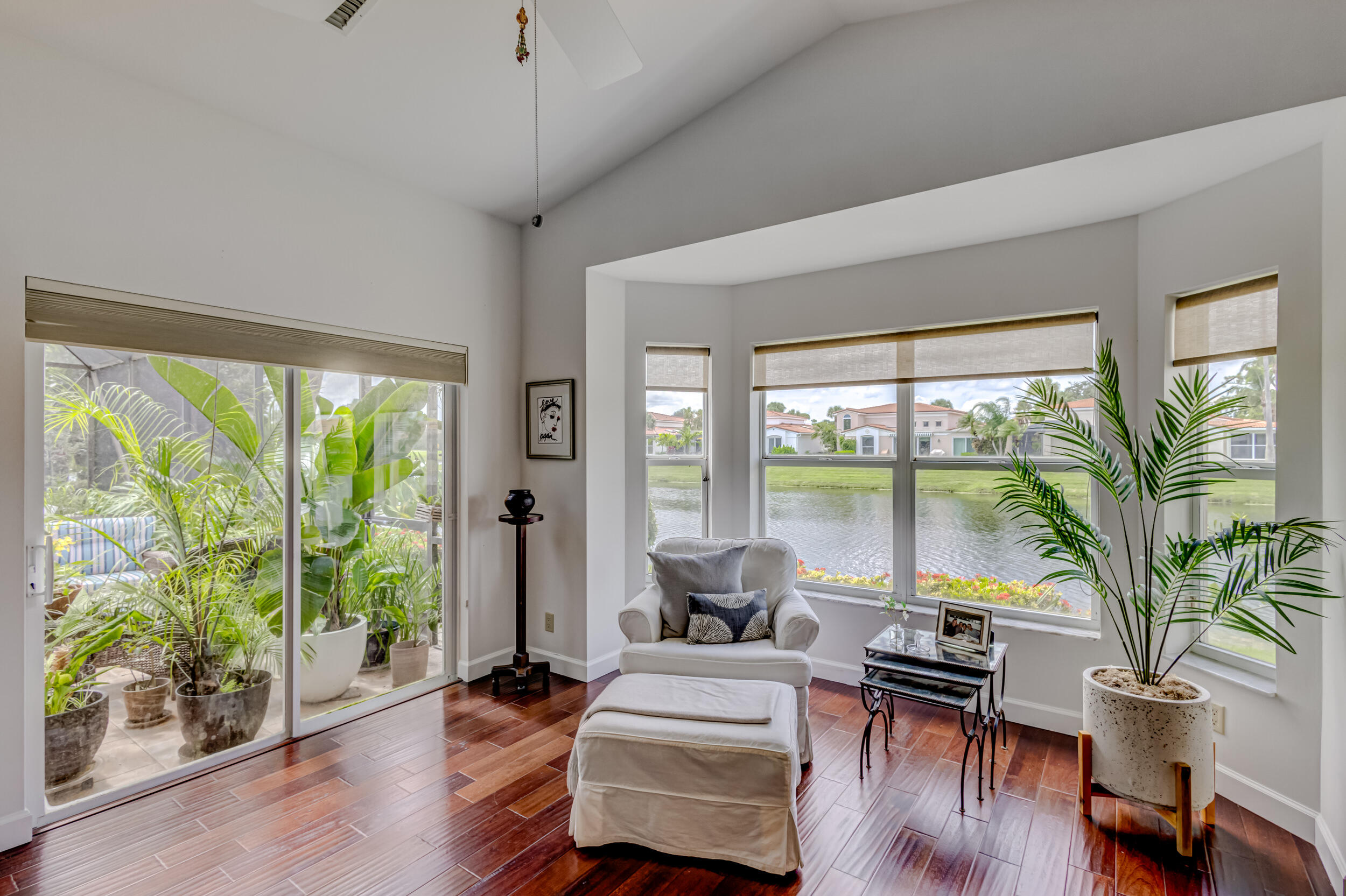 3546 Lantern Bay Drive Jupiter, FL 33477 - Photo 14 of 25 a living room with furniture and a large window with wooden floor