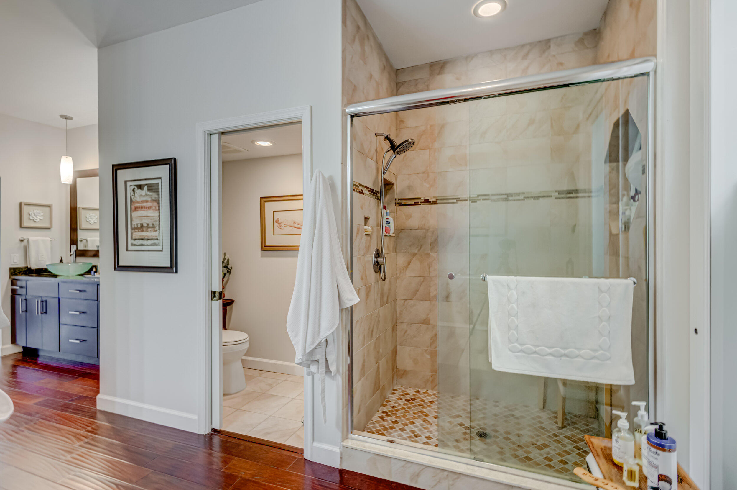 3546 Lantern Bay Drive Jupiter, FL 33477 - Photo 17 of 25 a bathroom with a glass shower door