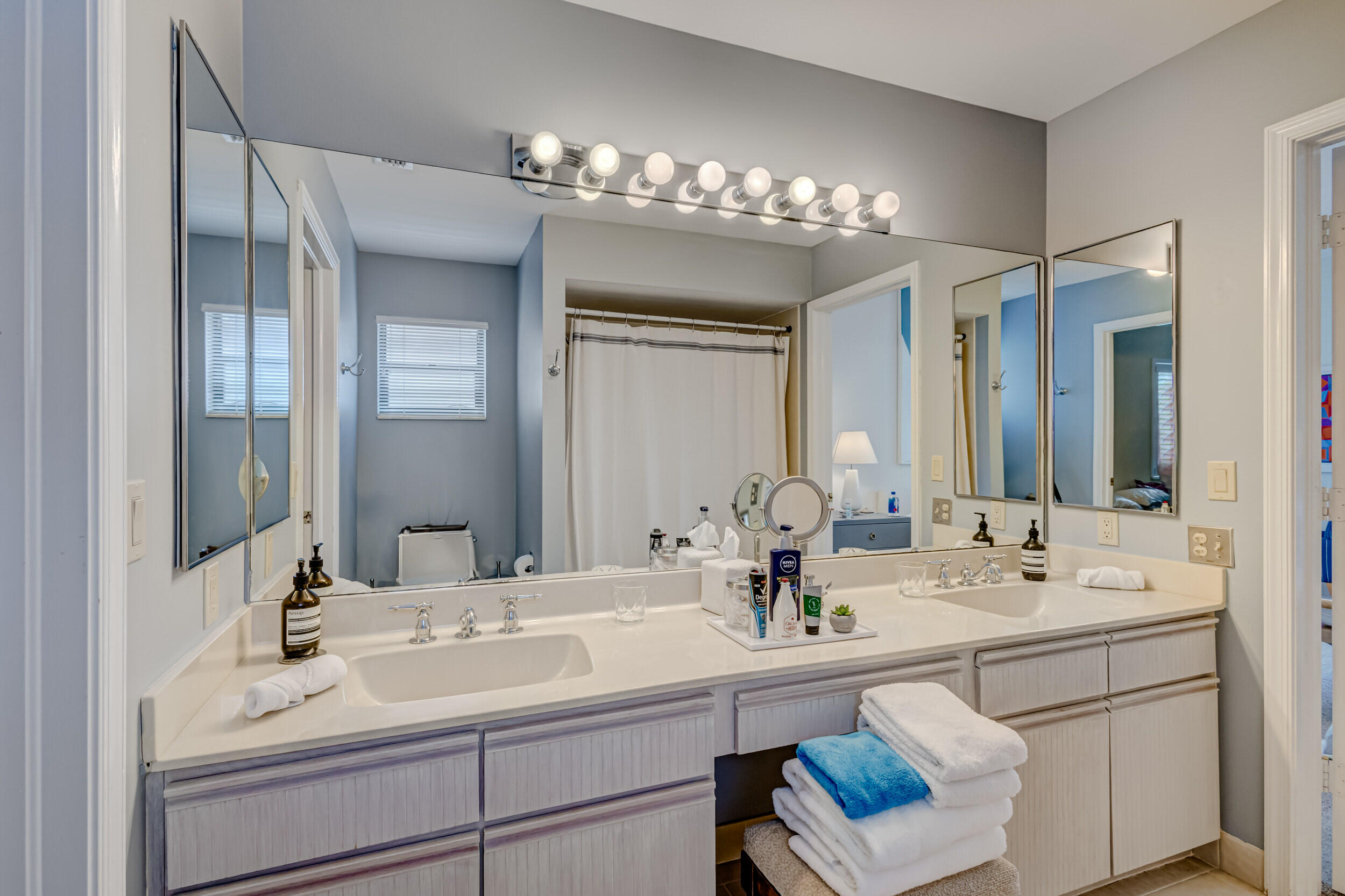 3546 Lantern Bay Drive Jupiter, FL 33477 - Photo 19 of 25 a bathroom with a sink double vanity and a mirror