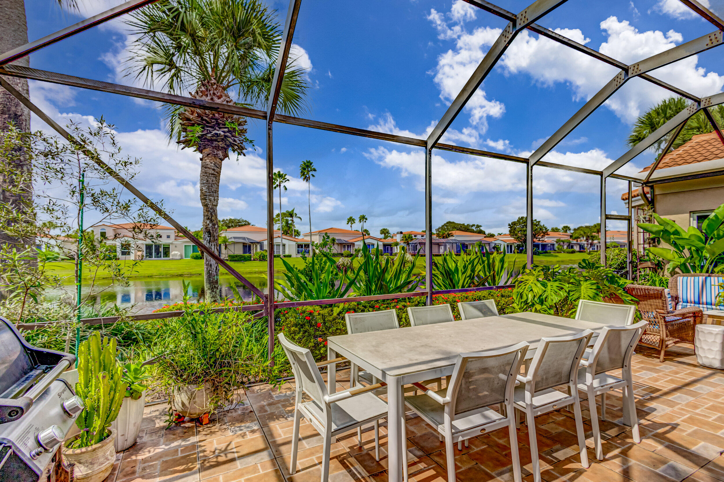 3546 Lantern Bay Drive Jupiter, FL 33477 - Photo 22 of 25 a view of an outdoor dining space with a table and chairs