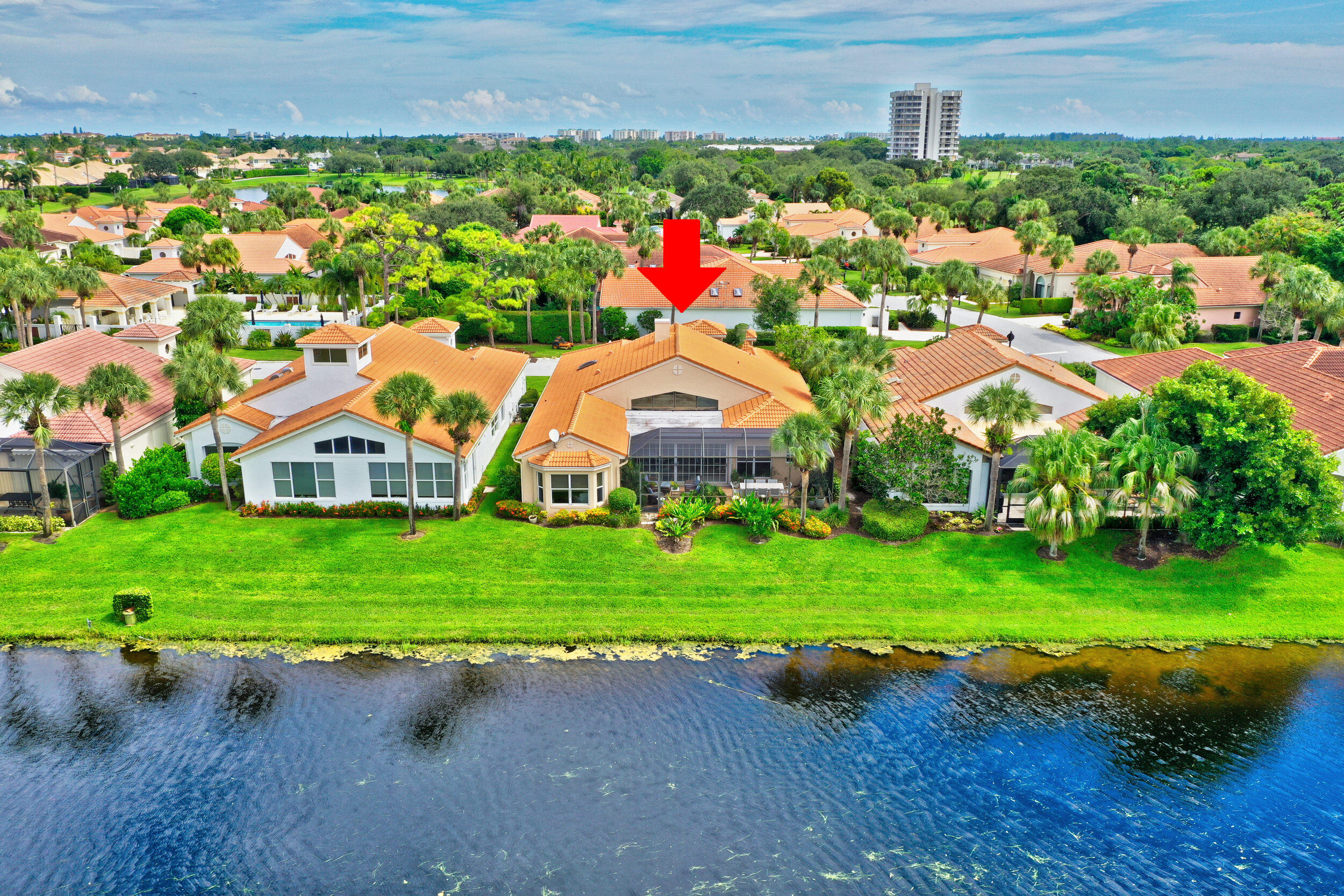 3546 Lantern Bay Drive Jupiter, FL 33477 - Photo 23 of 25 a view of a house with a yard and lake