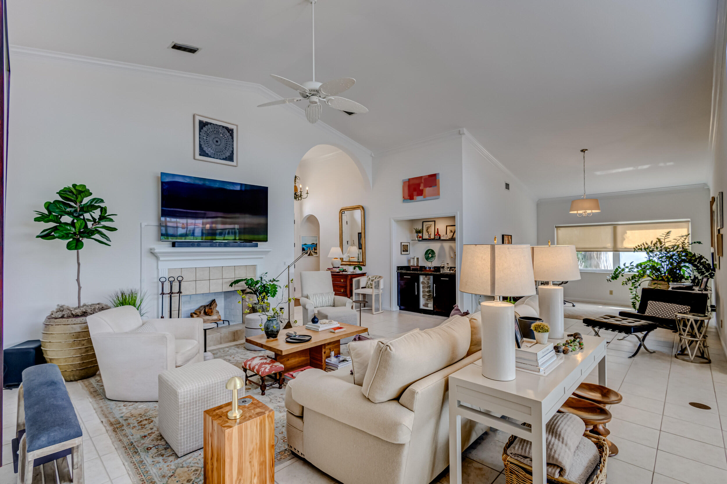 3546 Lantern Bay Drive Jupiter, FL 33477 - Photo 4 of 25 a living room with fireplace furniture and a flat screen tv
