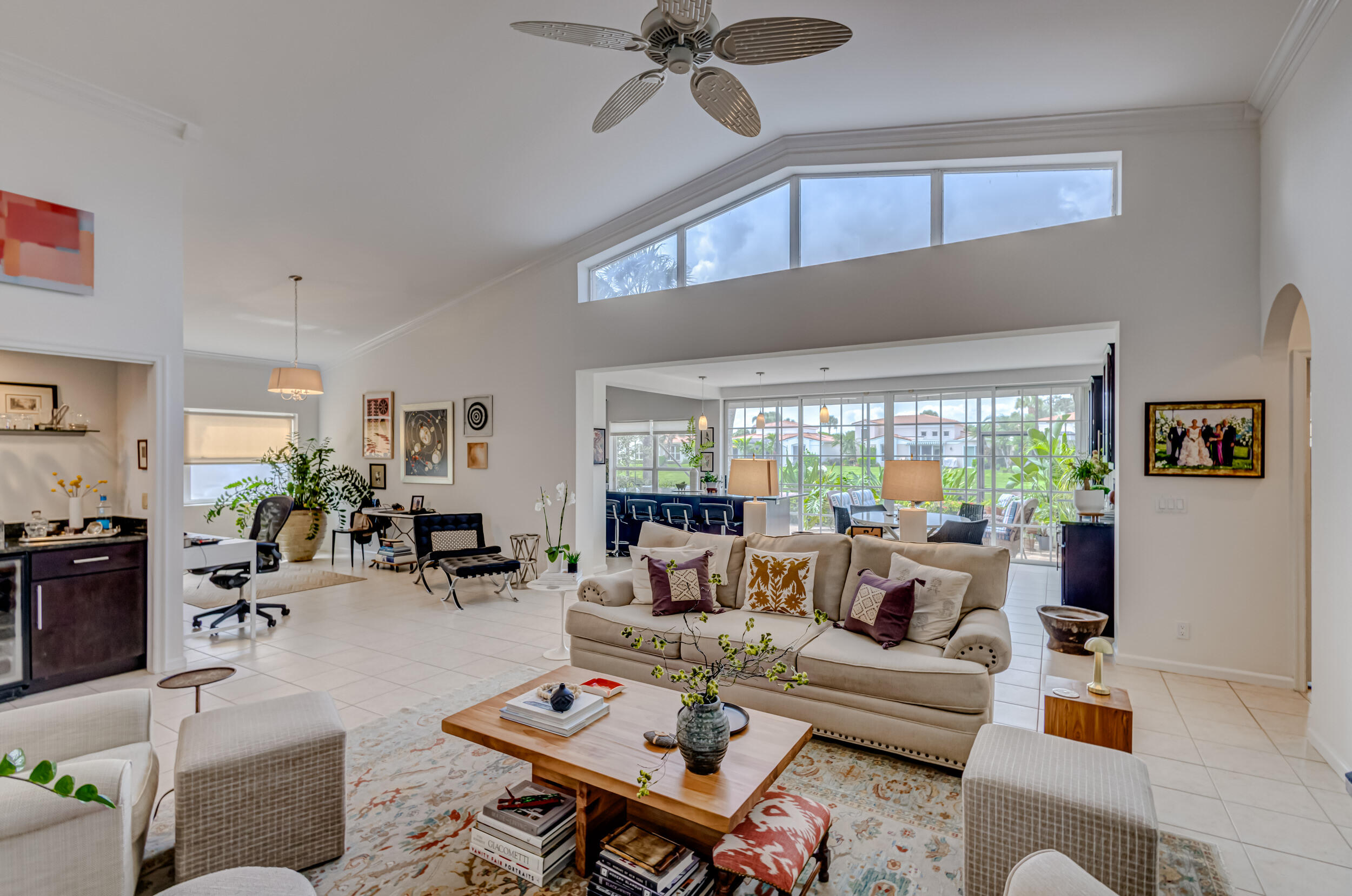 3546 Lantern Bay Drive Jupiter, FL 33477 - Photo 5 of 25 a living room with furniture a table and a large window