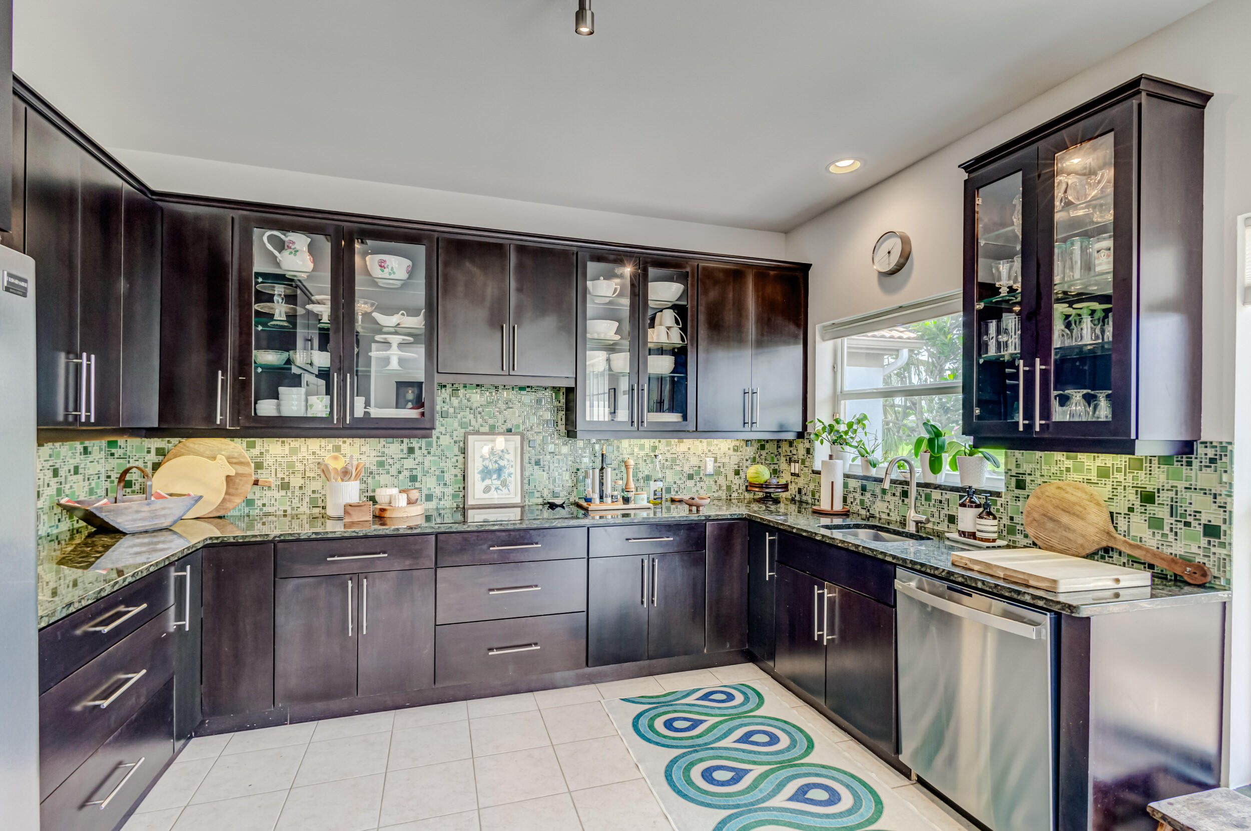 3546 Lantern Bay Drive Jupiter, FL 33477 - Photo 8 of 25 a kitchen with a sink and cabinets