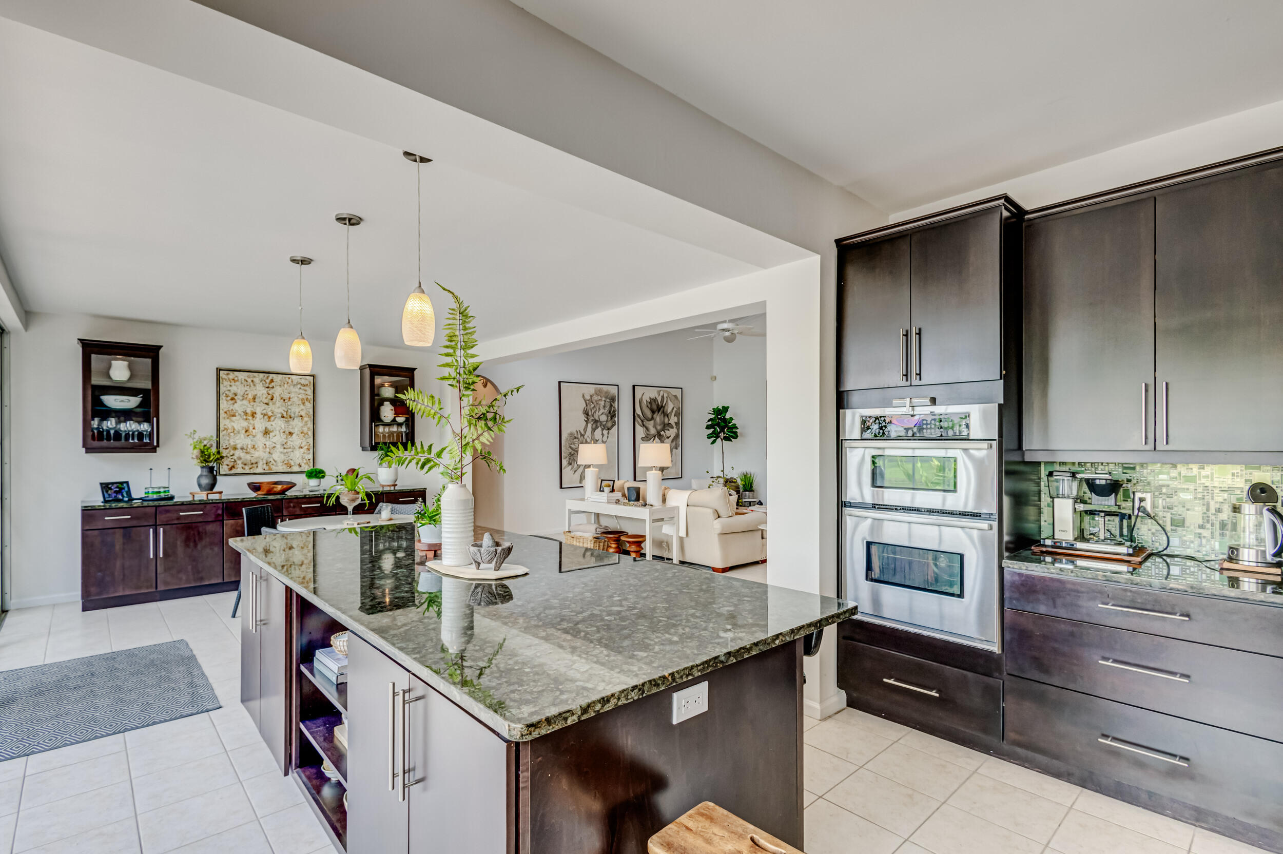 3546 Lantern Bay Drive Jupiter, FL 33477 - Photo 10 of 25 a kitchen with a stove and a refrigerator