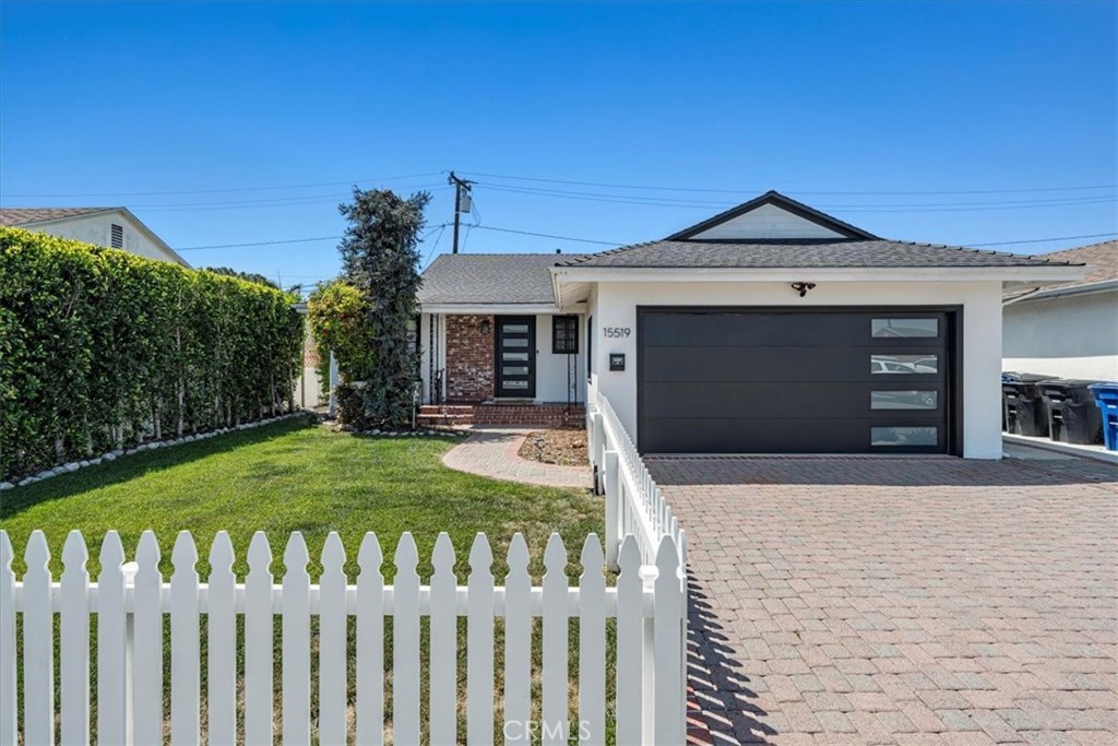 15519 Roselle Avenue Lawndale, CA 90260 - Photo 1 of 28 a front view of a house with a yard