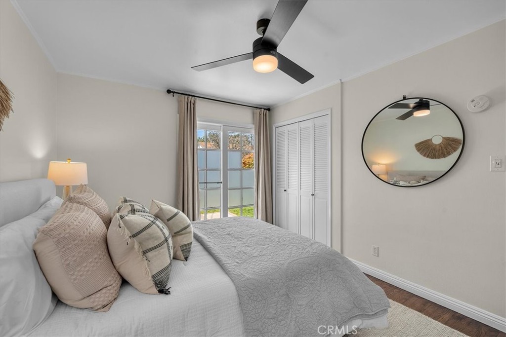 15519 Roselle Avenue Lawndale, CA 90260 - Photo 13 of 28 a bedroom with a bed and a chandelier