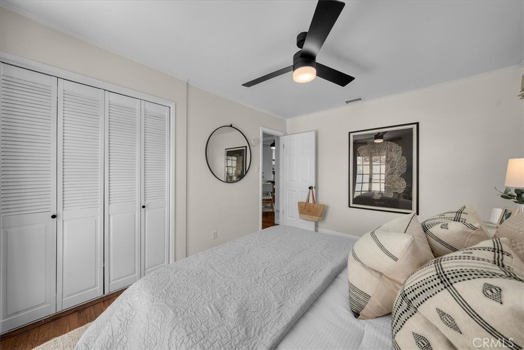 15519 Roselle Avenue Lawndale, CA 90260 - Photo 15 of 28 a bedroom with a large bed and a chandelier