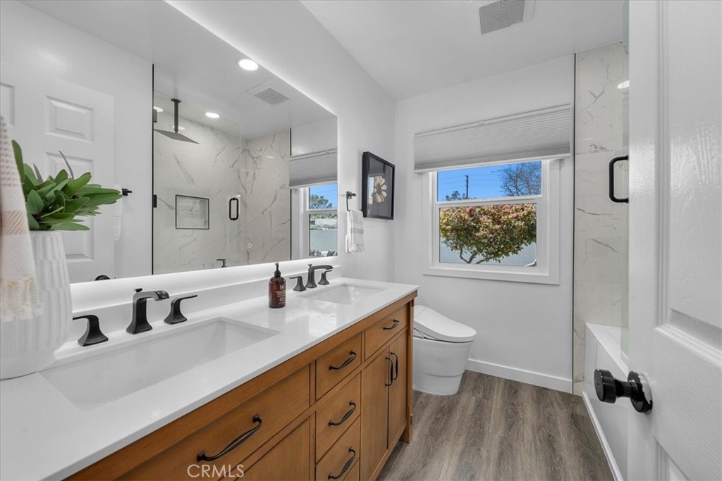 15519 Roselle Avenue Lawndale, CA 90260 - Photo 16 of 28 a bathroom with a sink a toilet and shower